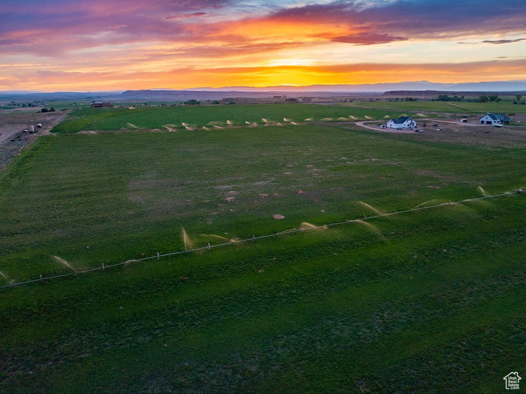 Aerial view at dusk featuring a rural view