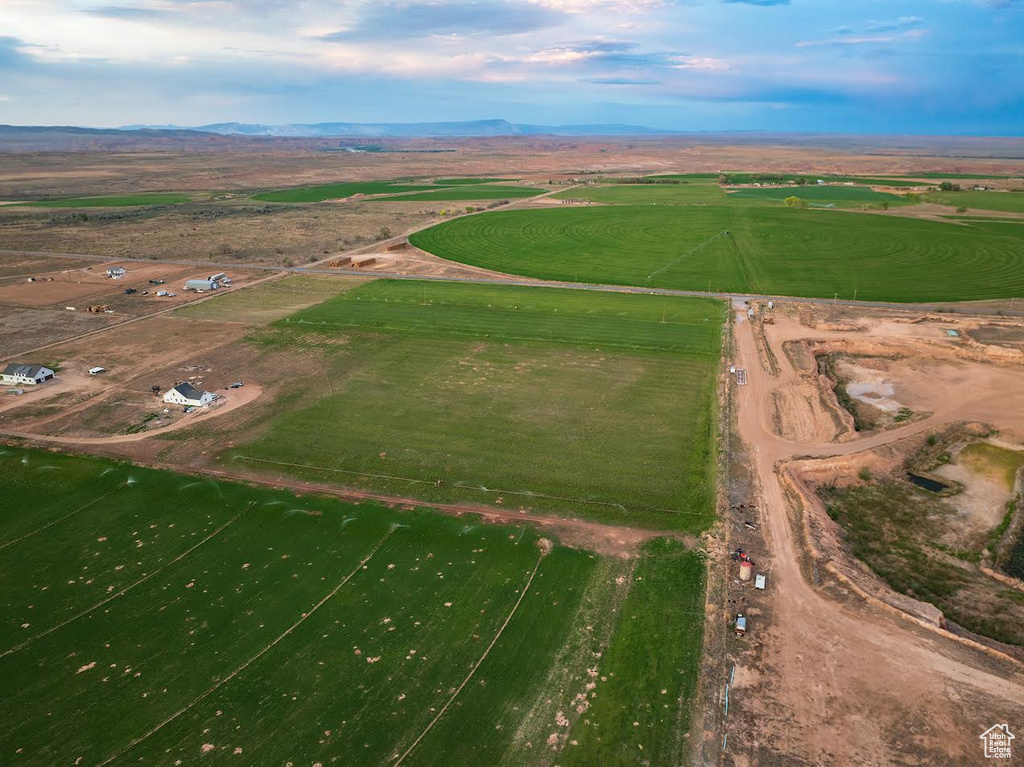 Birds eye view of property with a rural view