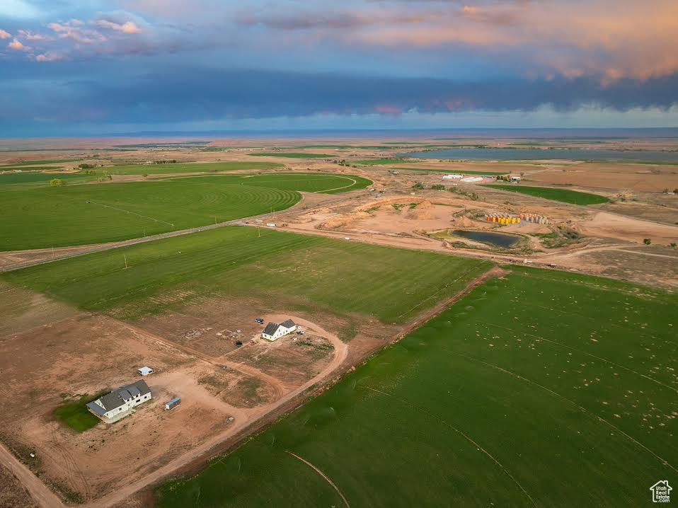 Aerial view at dusk featuring a rural view