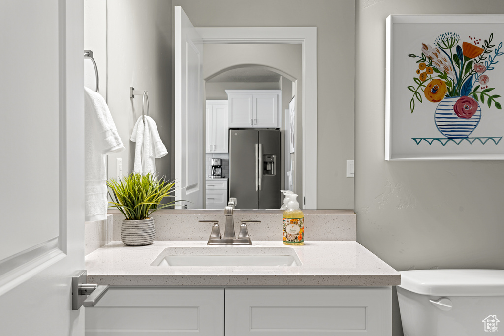 Bathroom with toilet and vanity