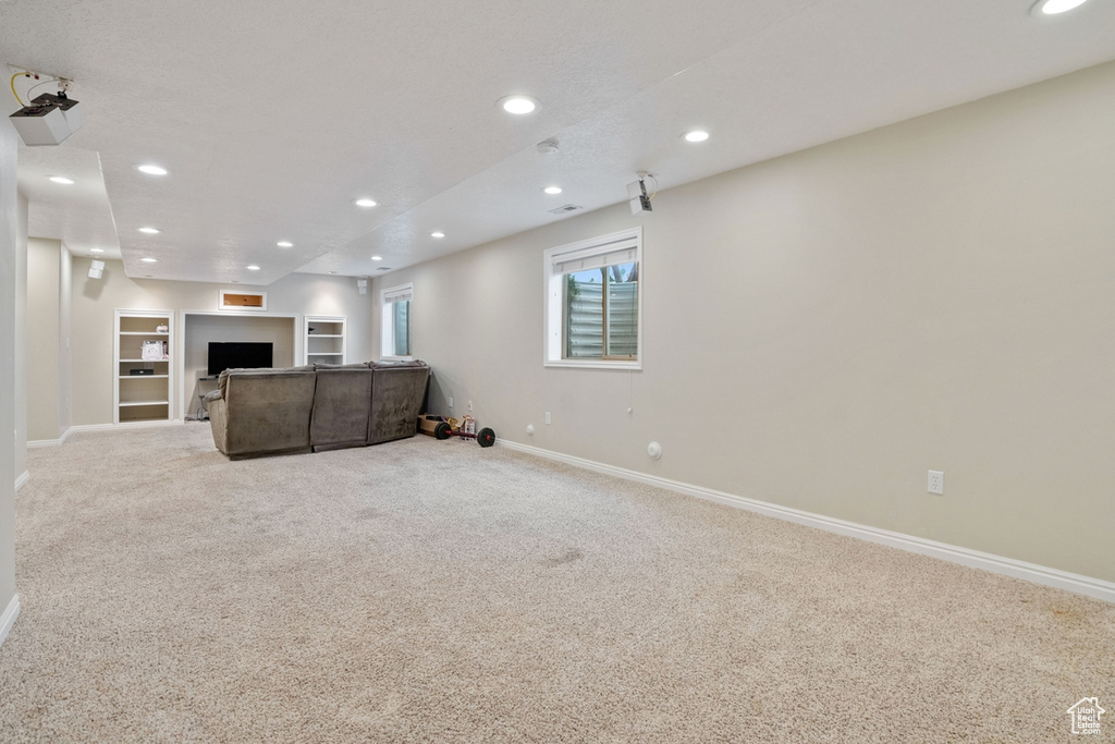 Unfurnished living room with carpet floors