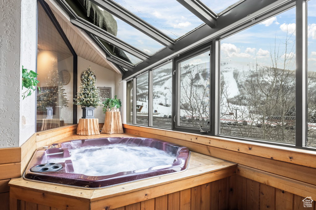 Misc room with a skylight and a hot tub