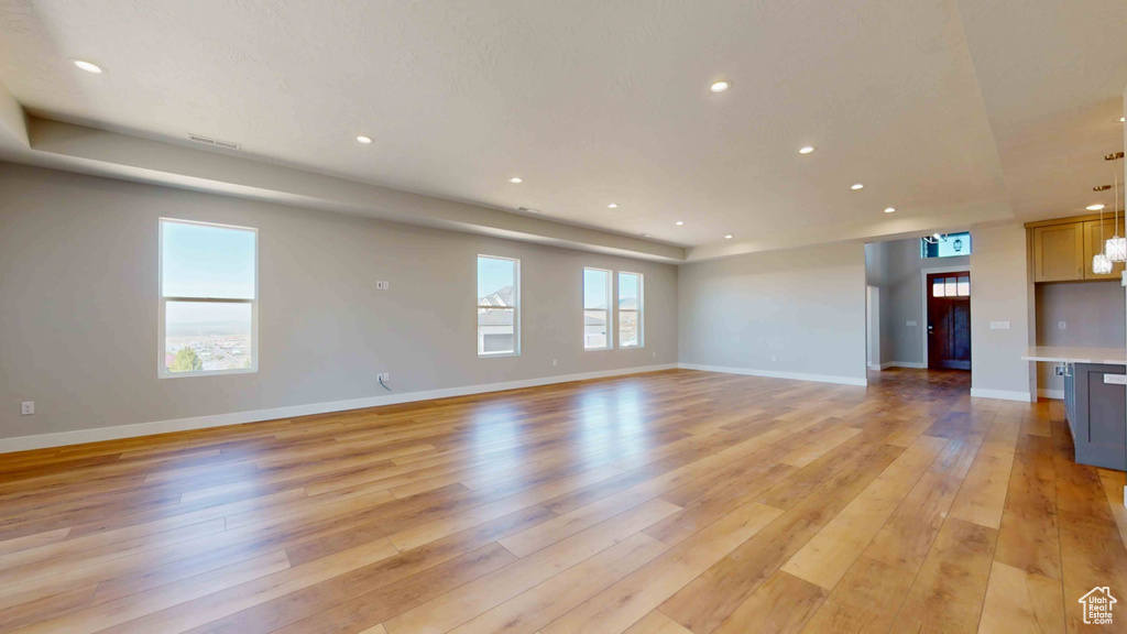 Unfurnished living room with light wood-type flooring