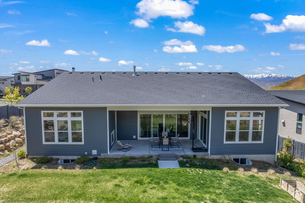 Single story home featuring a patio area and a front yard