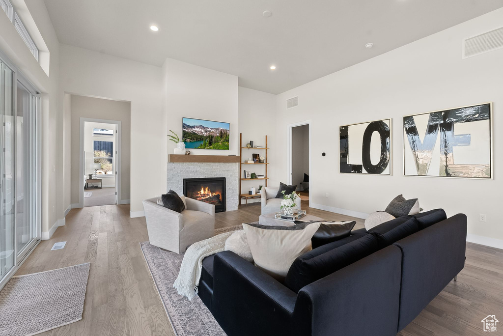 Living room featuring light hardwood / wood-style floors and a fireplace