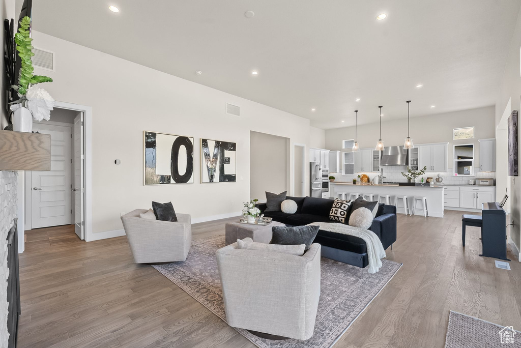 Living room with light wood-type flooring