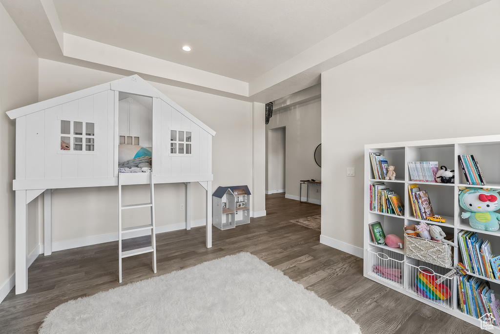 Bedroom featuring dark hardwood / wood-style flooring