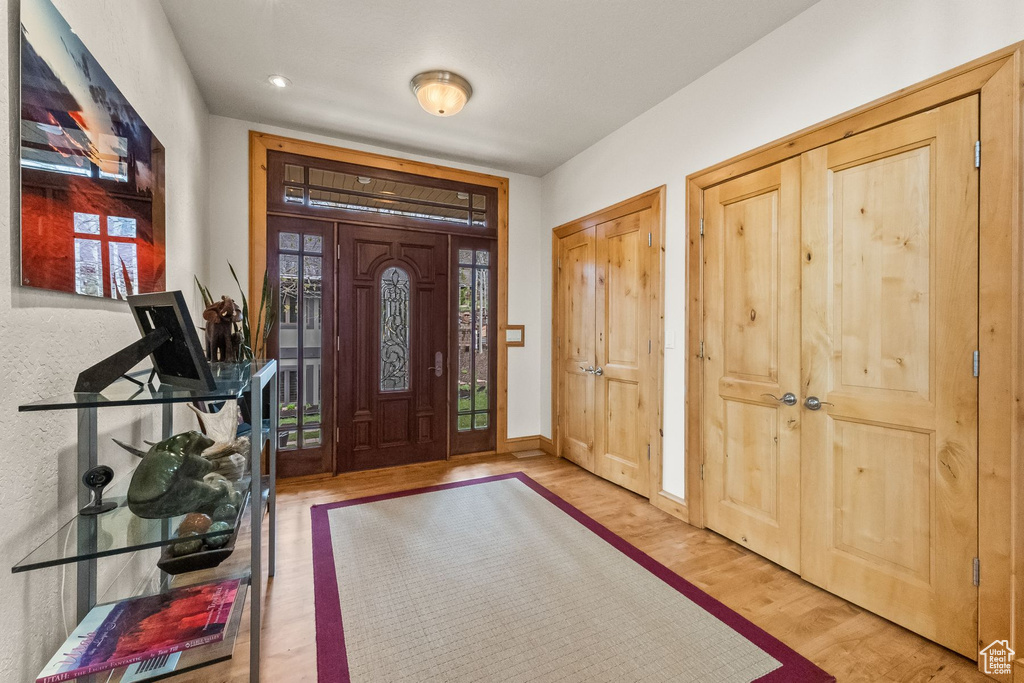 Entryway with hardwood / wood-style floors