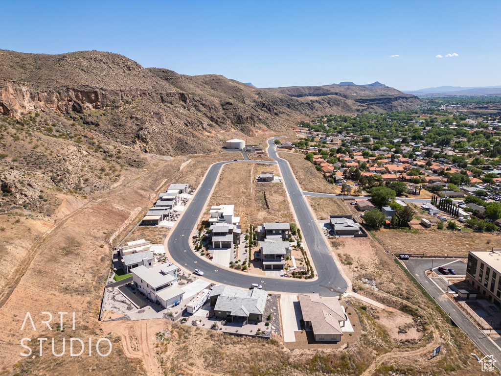 Birds eye view of property with a mountain view