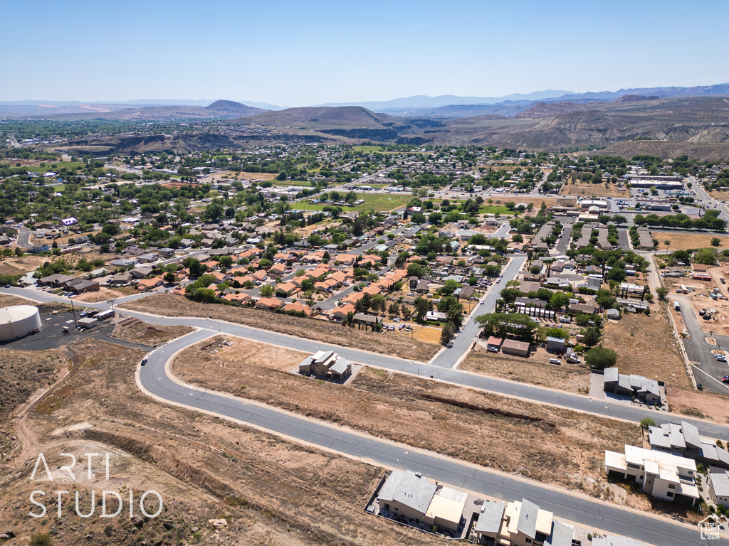 Birds eye view of property with a mountain view