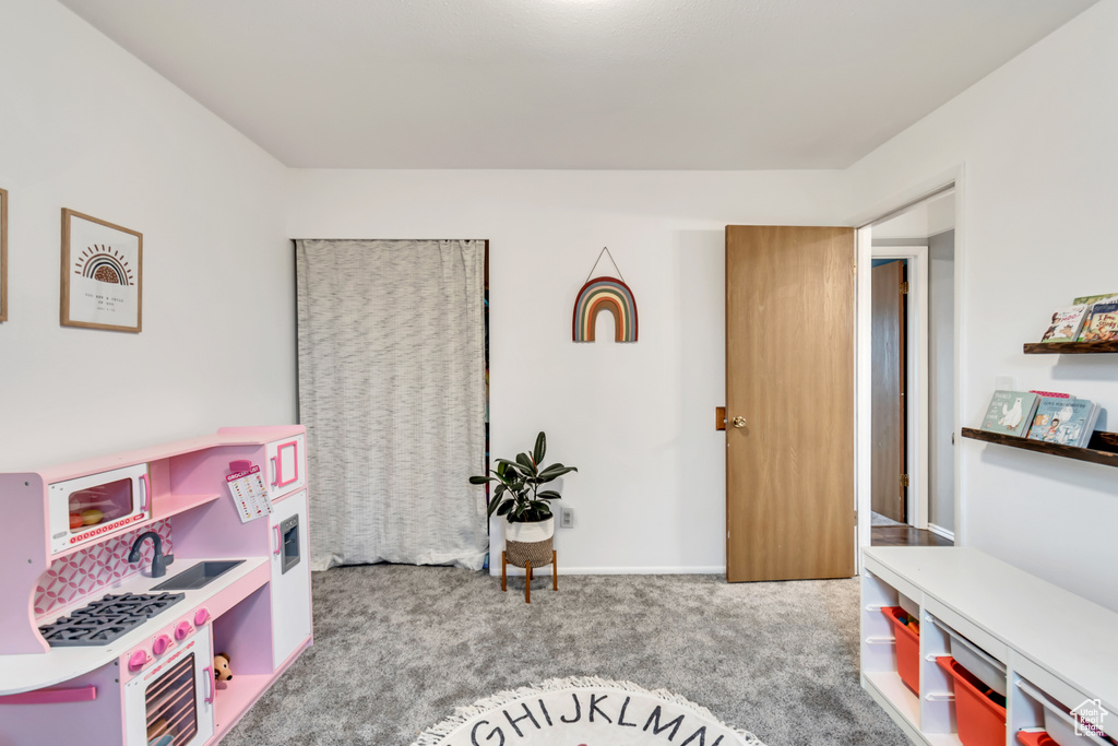 Playroom featuring light colored carpet