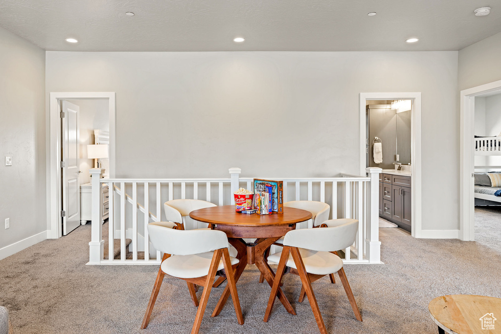 Dining room featuring light colored carpet