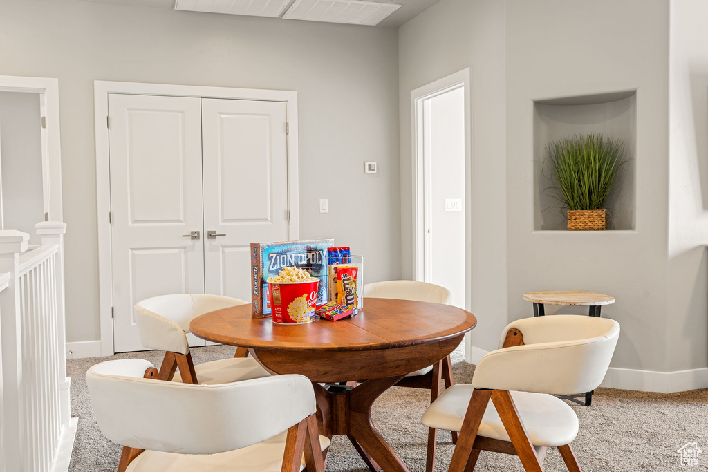 Dining area with carpet flooring