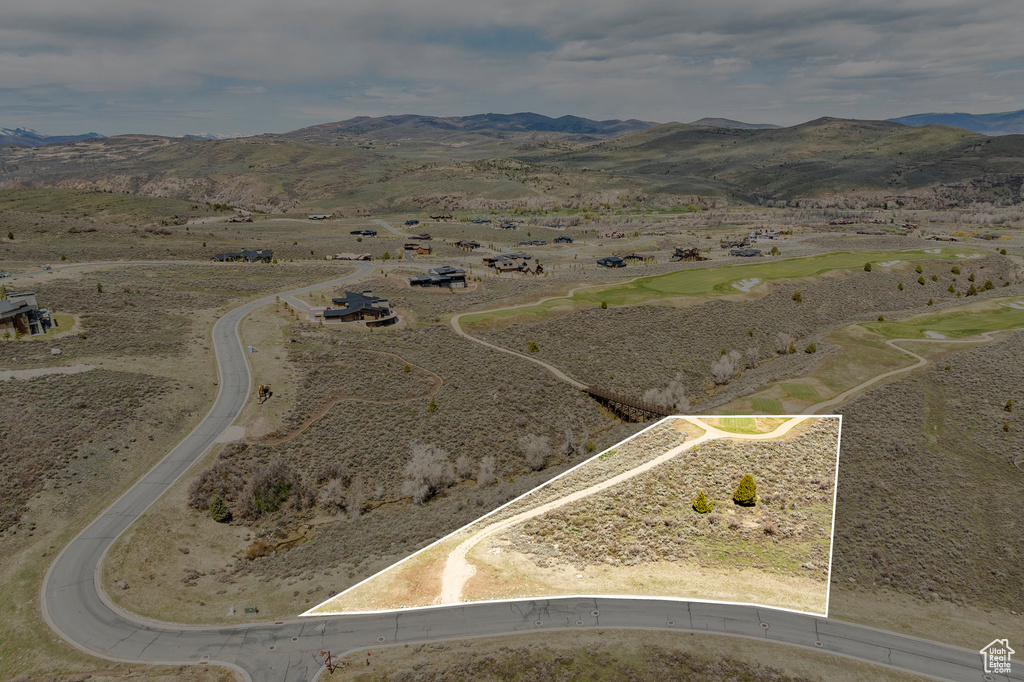 Birds eye view of property with a mountain view and a rural view