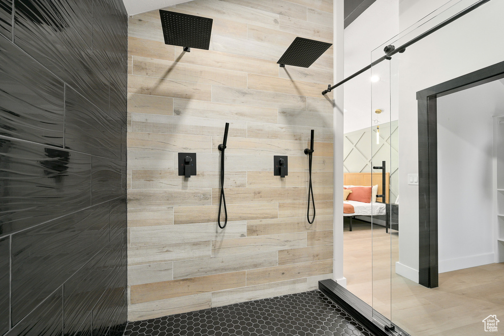 Bathroom with tile floors and tiled shower