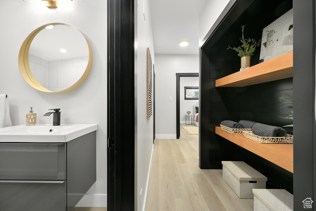 Bathroom featuring wood-type flooring and oversized vanity