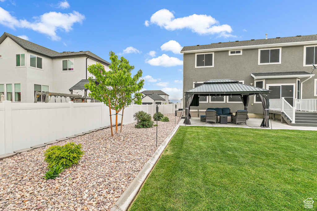 View of yard with a patio area, a gazebo, and an outdoor living space