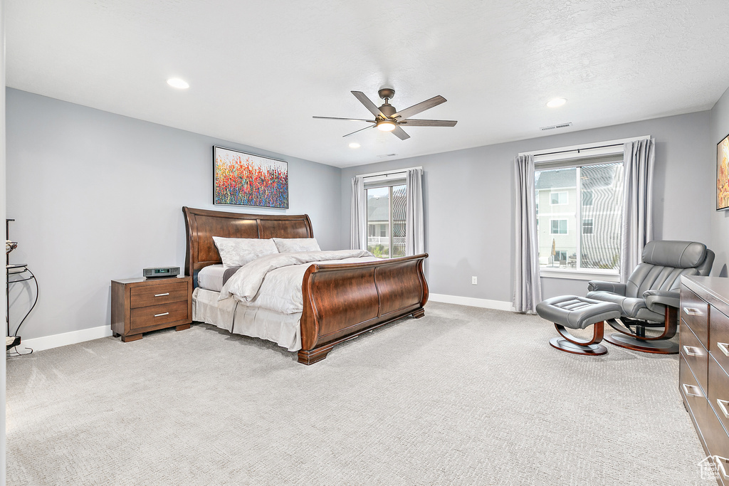 Bedroom featuring ceiling fan and carpet flooring