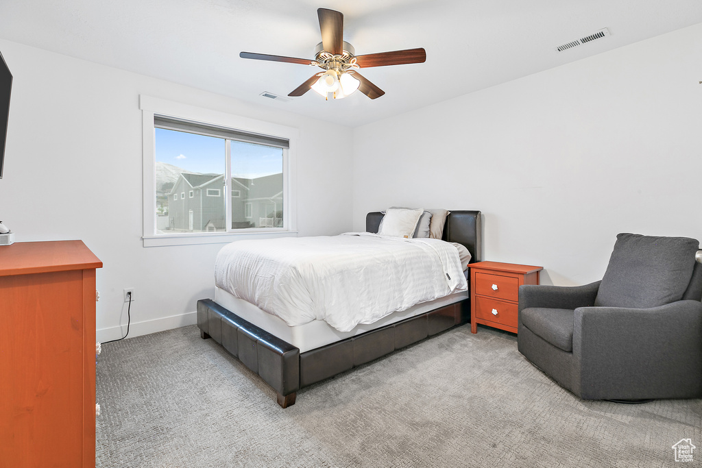 Bedroom featuring carpet and ceiling fan