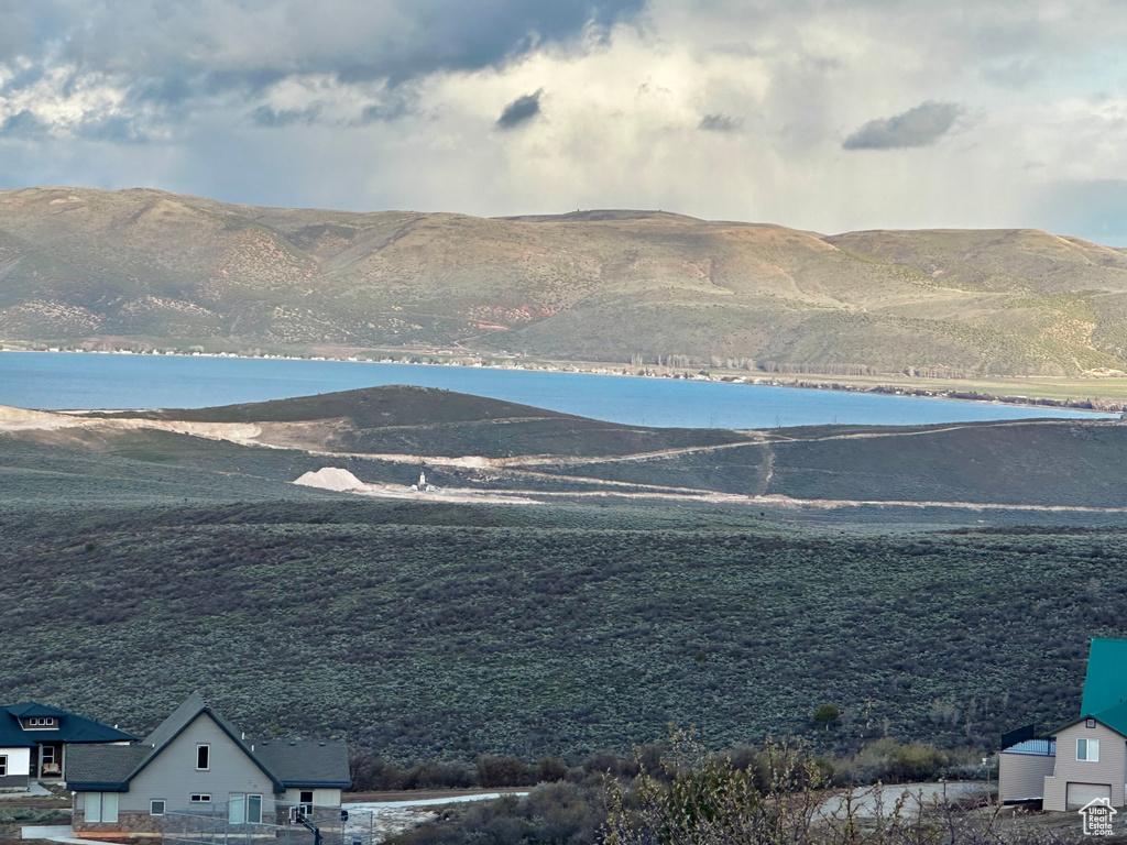 Mountain view featuring a water view