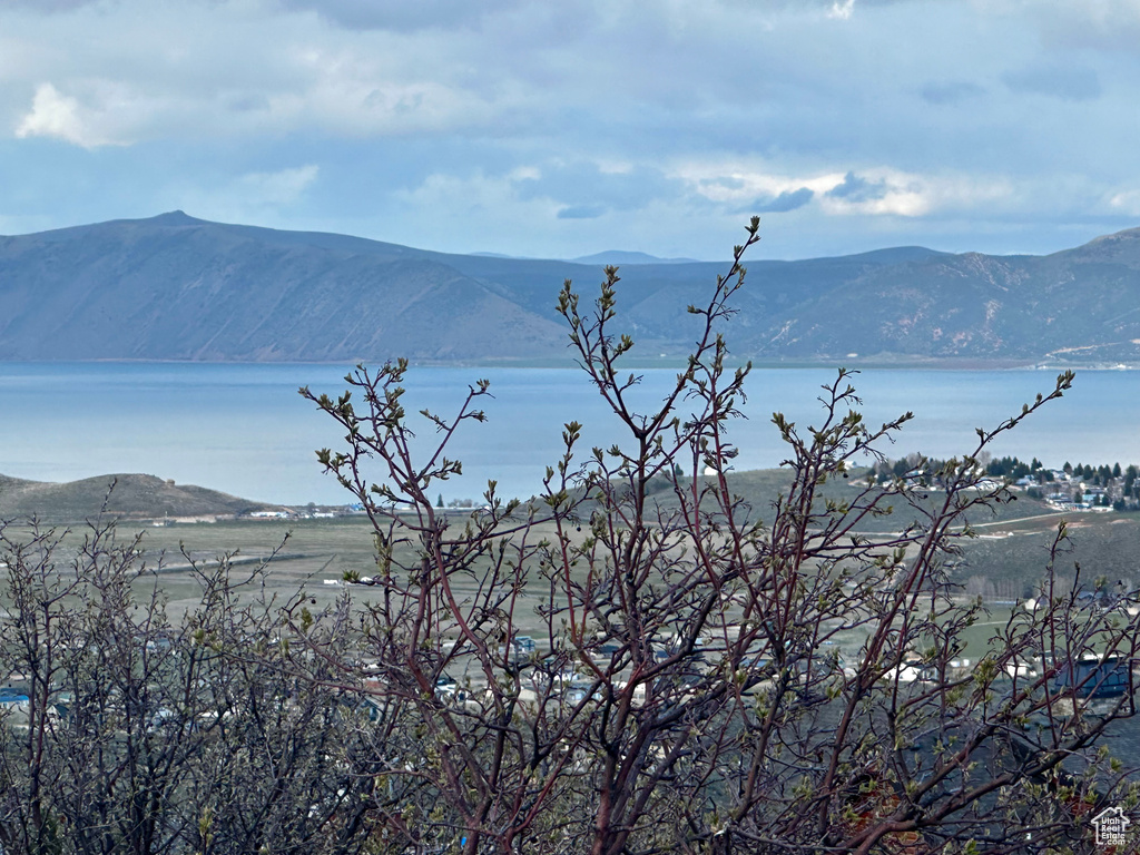 Property view of mountains featuring a water view