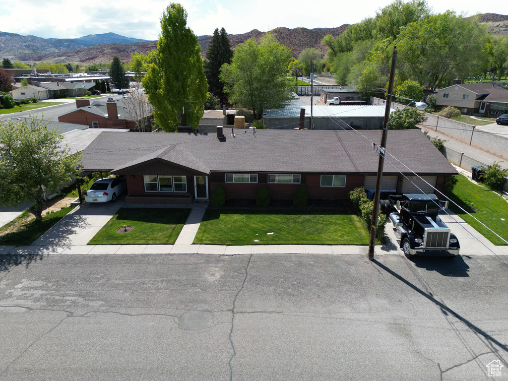 Birds eye view of property with a mountain view