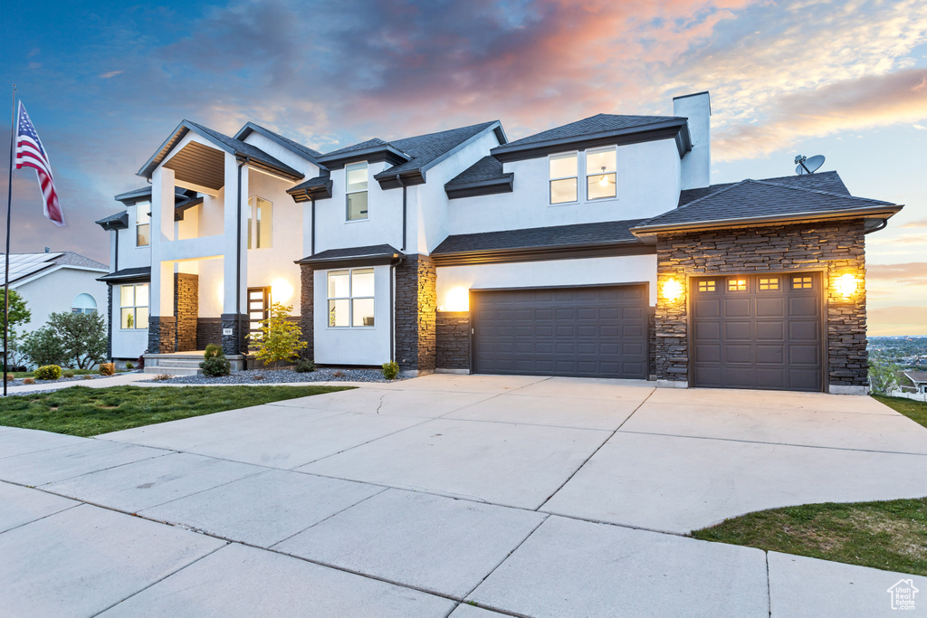 View of front of property with a garage