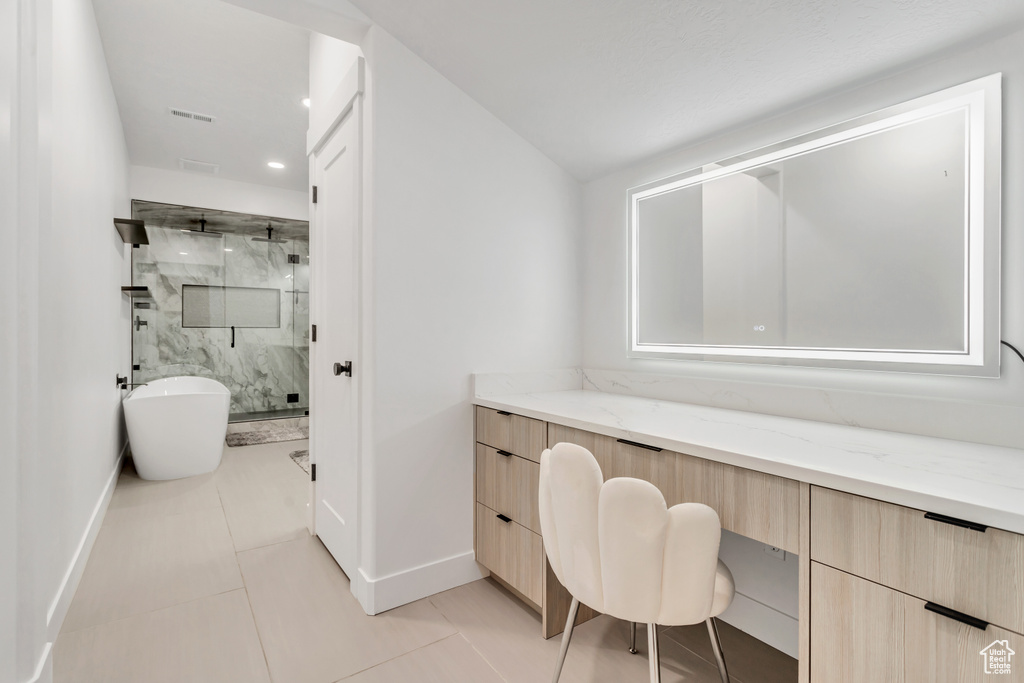 Tiled home office featuring built in desk