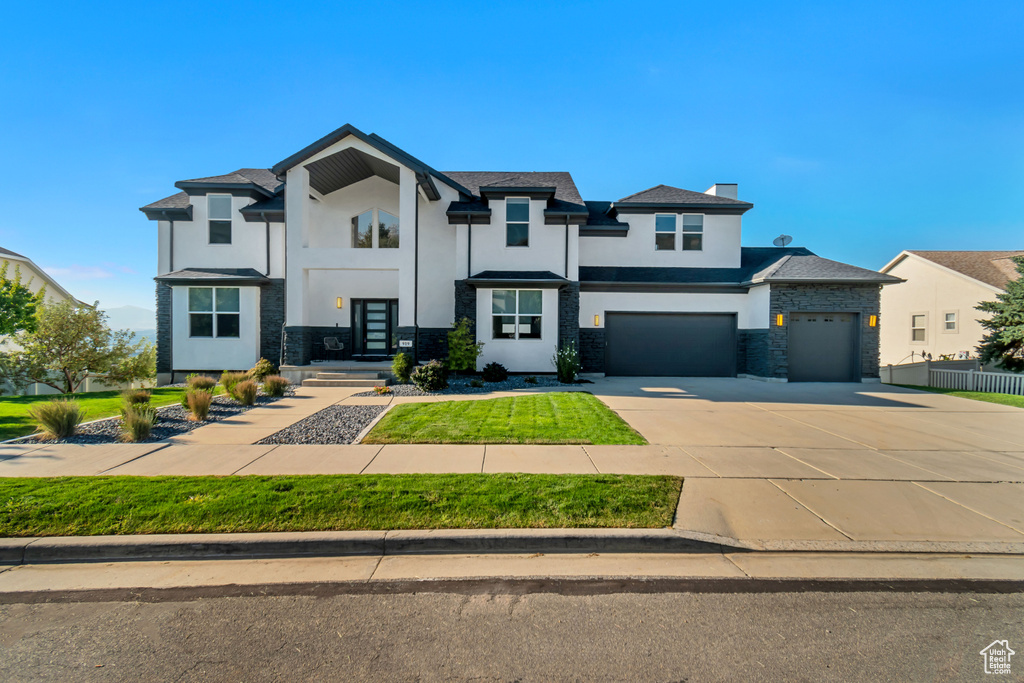 View of front of home featuring a garage