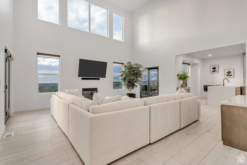 Living room featuring a towering ceiling