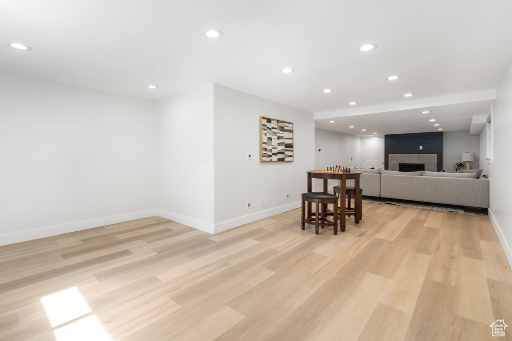 Interior space featuring a fireplace and light hardwood / wood-style floors