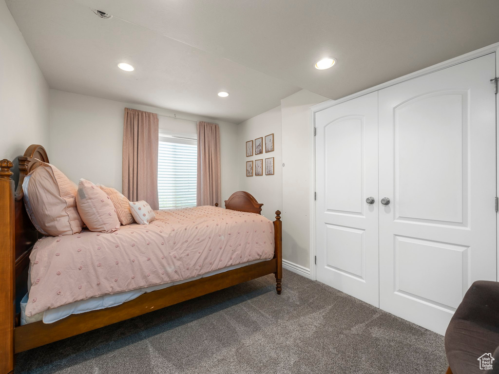 Bedroom with a closet and carpet floors