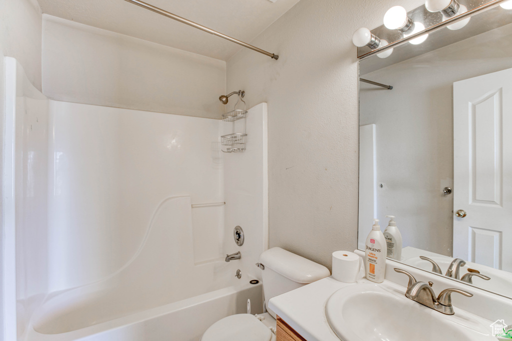 Full bathroom with vanity, toilet, and bathing tub / shower combination