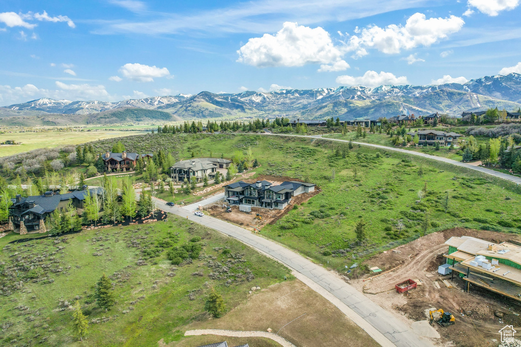 Birds eye view of property with a mountain view