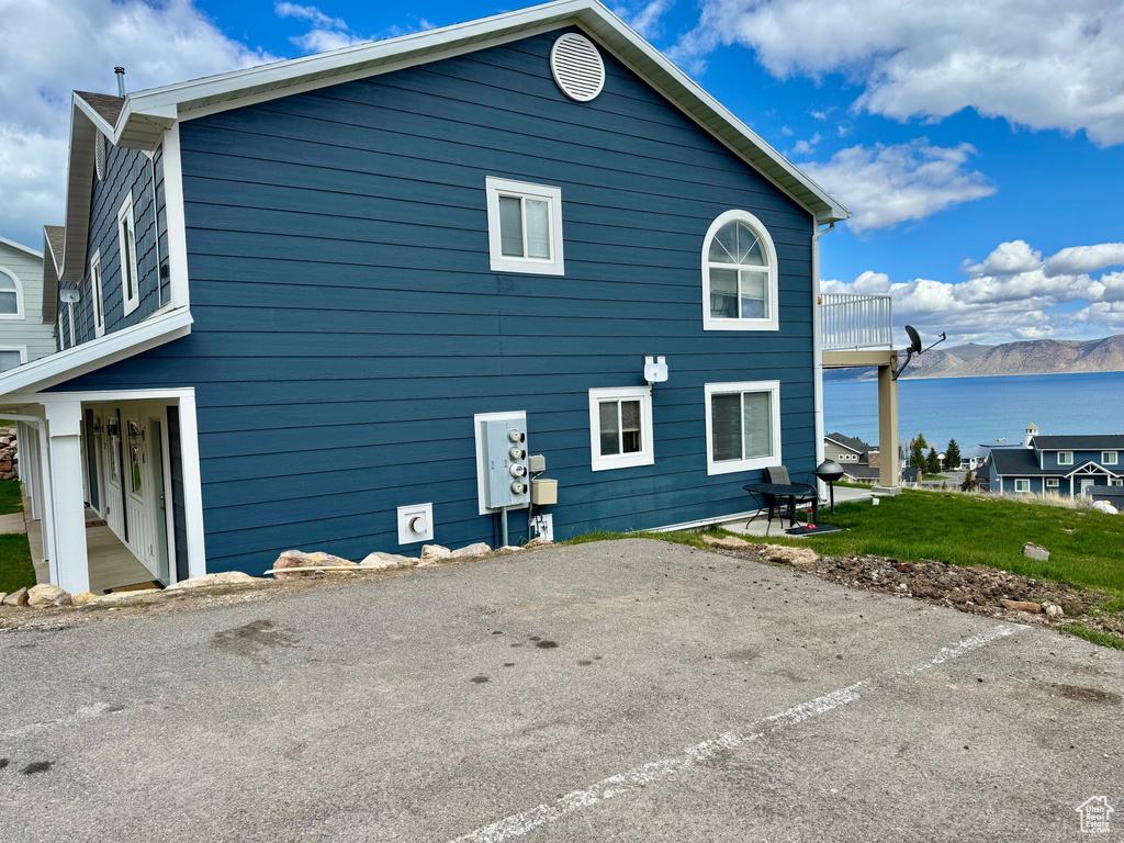 Rear view of property featuring a water view