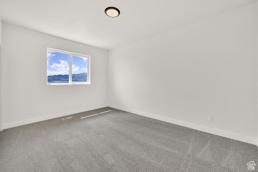 Spare room featuring carpet floors