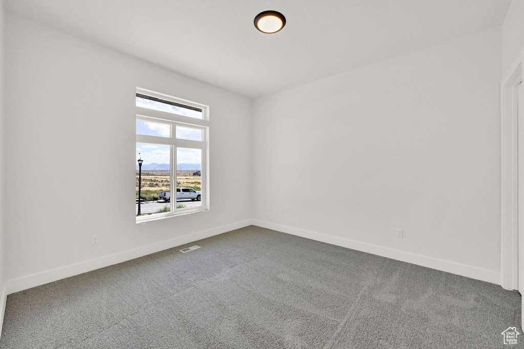 Empty room featuring carpet