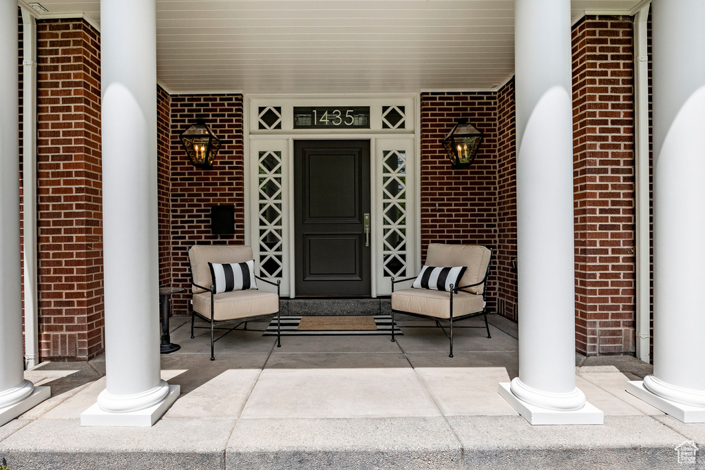 Doorway to property featuring a porch