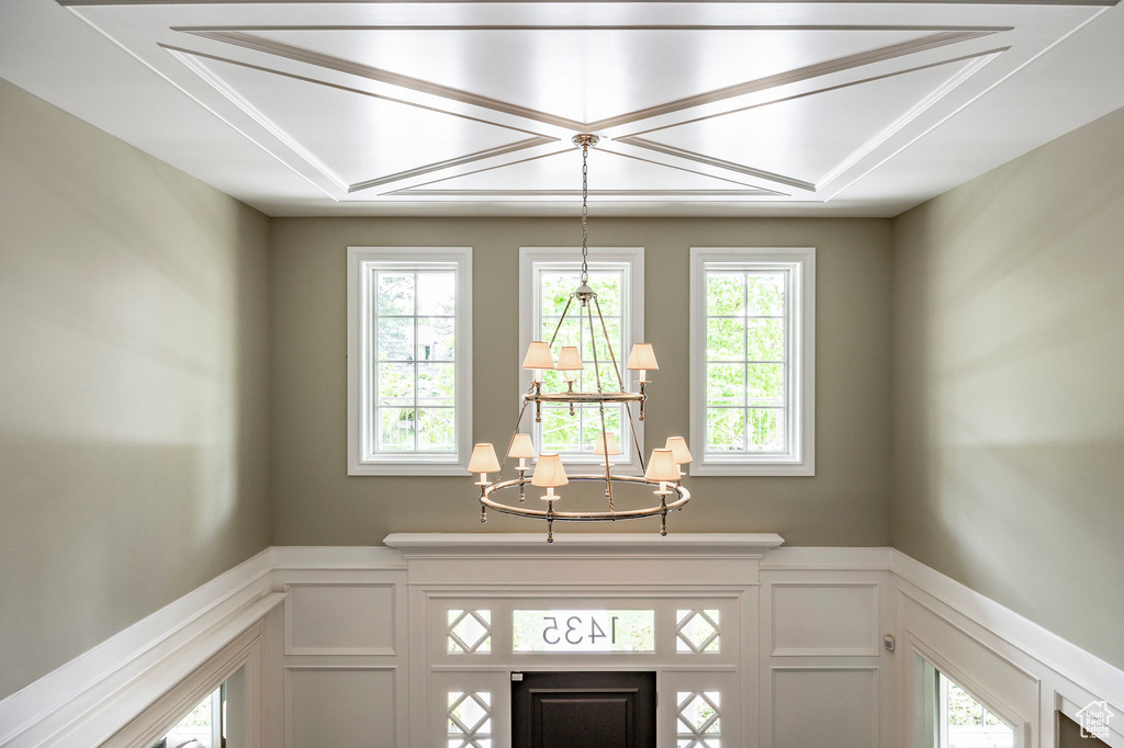 Room details featuring a notable chandelier