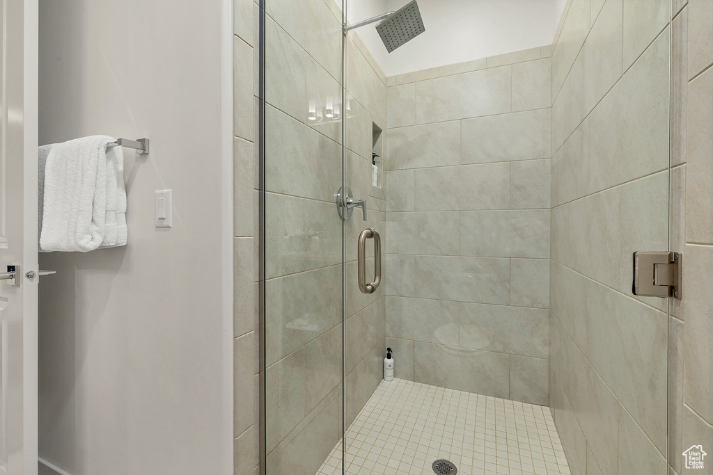 Bathroom featuring an enclosed shower and toilet