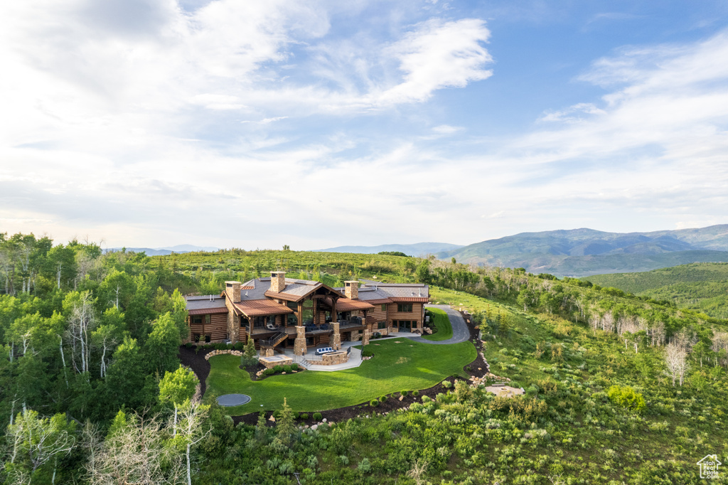 View of subject property featuring mountains