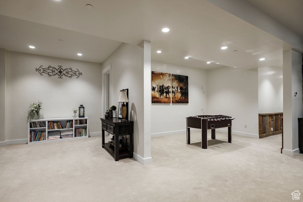 Recreation room featuring light colored carpet