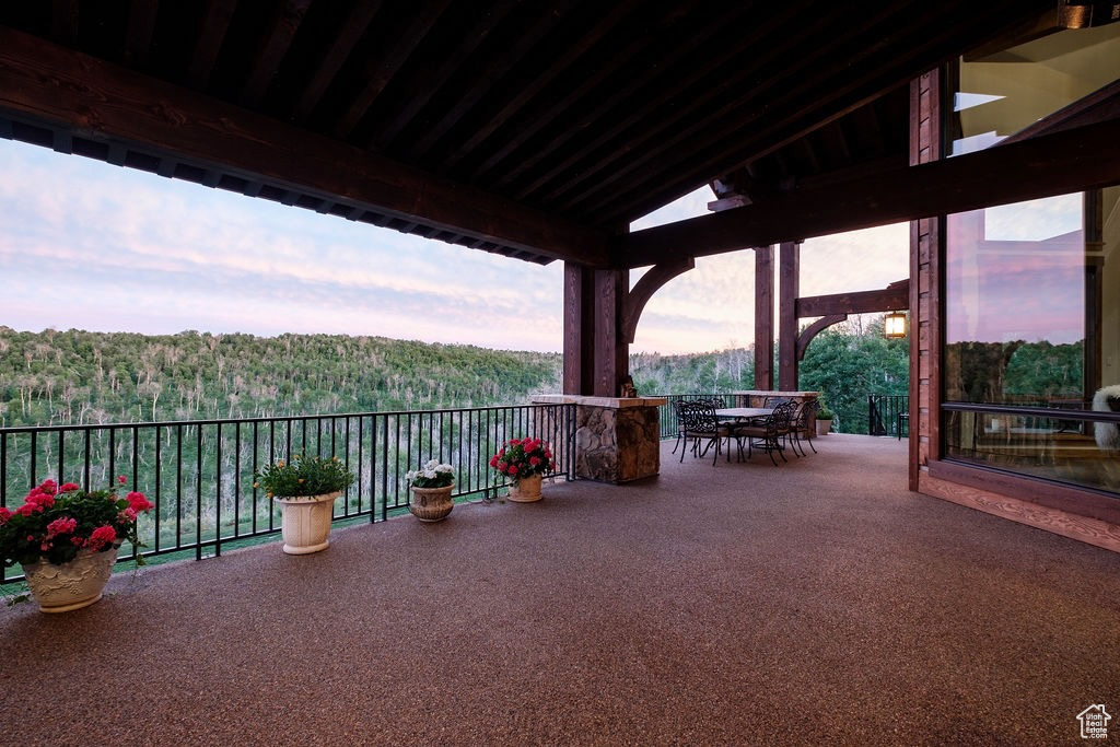 Patio terrace at dusk with a balcony