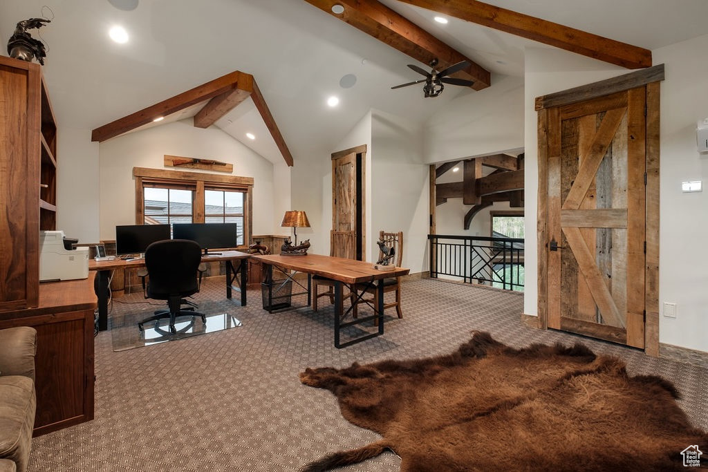 Carpeted office space with high vaulted ceiling, beamed ceiling, and ceiling fan