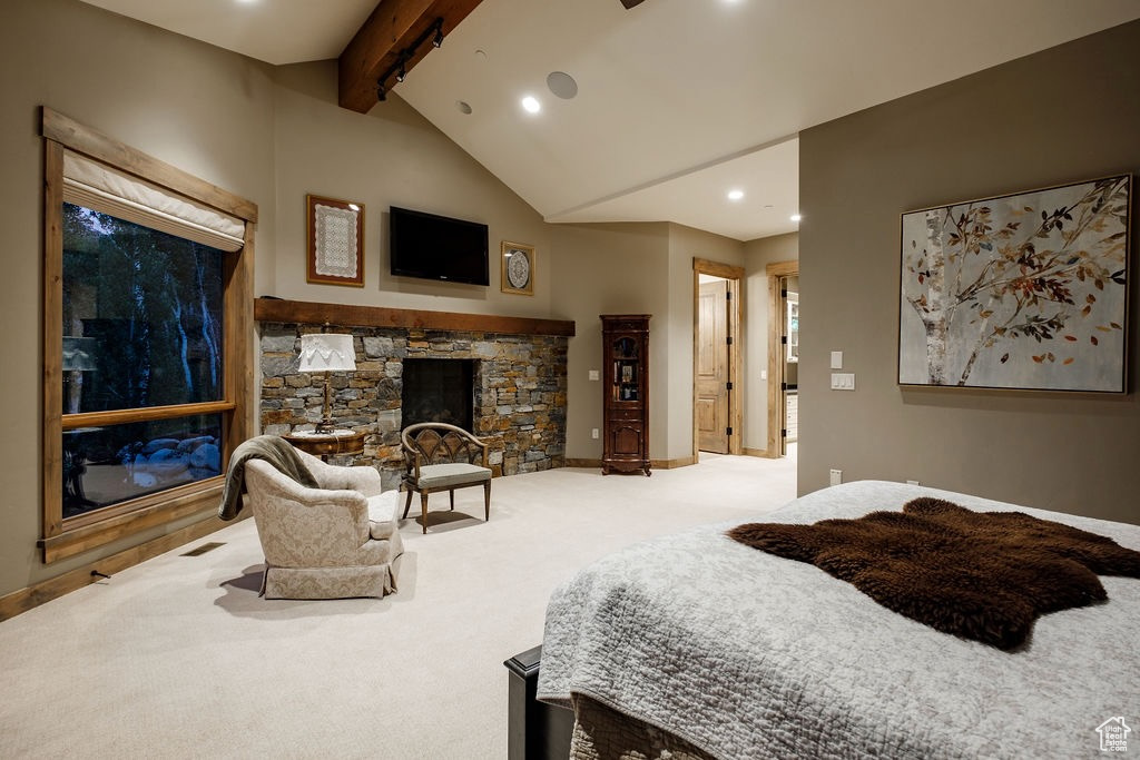 Bedroom with a stone fireplace, high vaulted ceiling, beamed ceiling, and carpet flooring