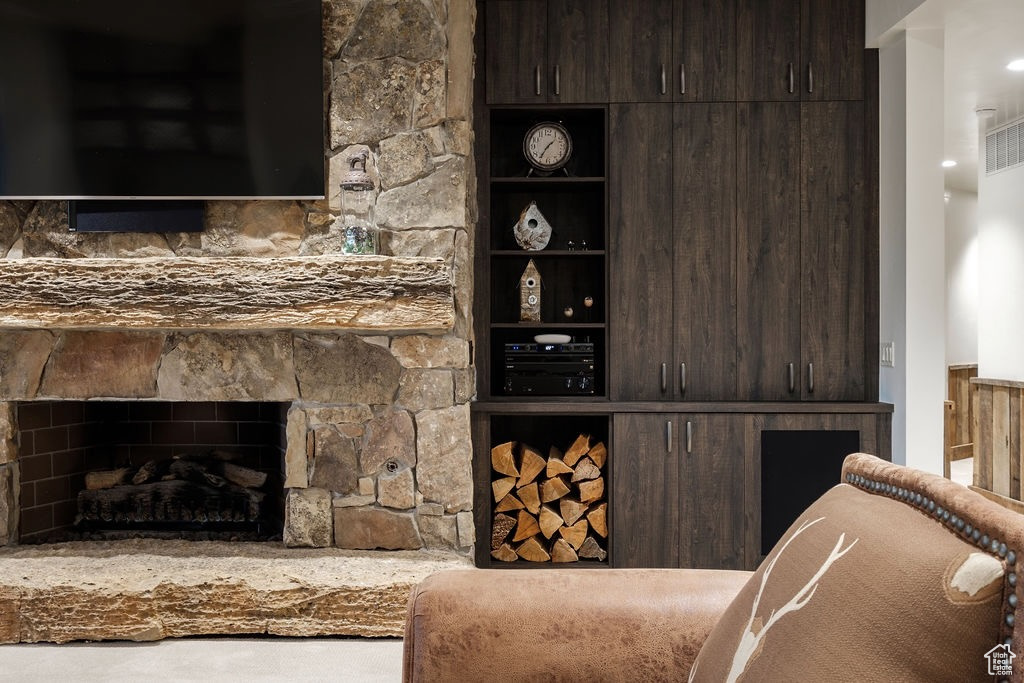 Living room featuring a fireplace and carpet floors