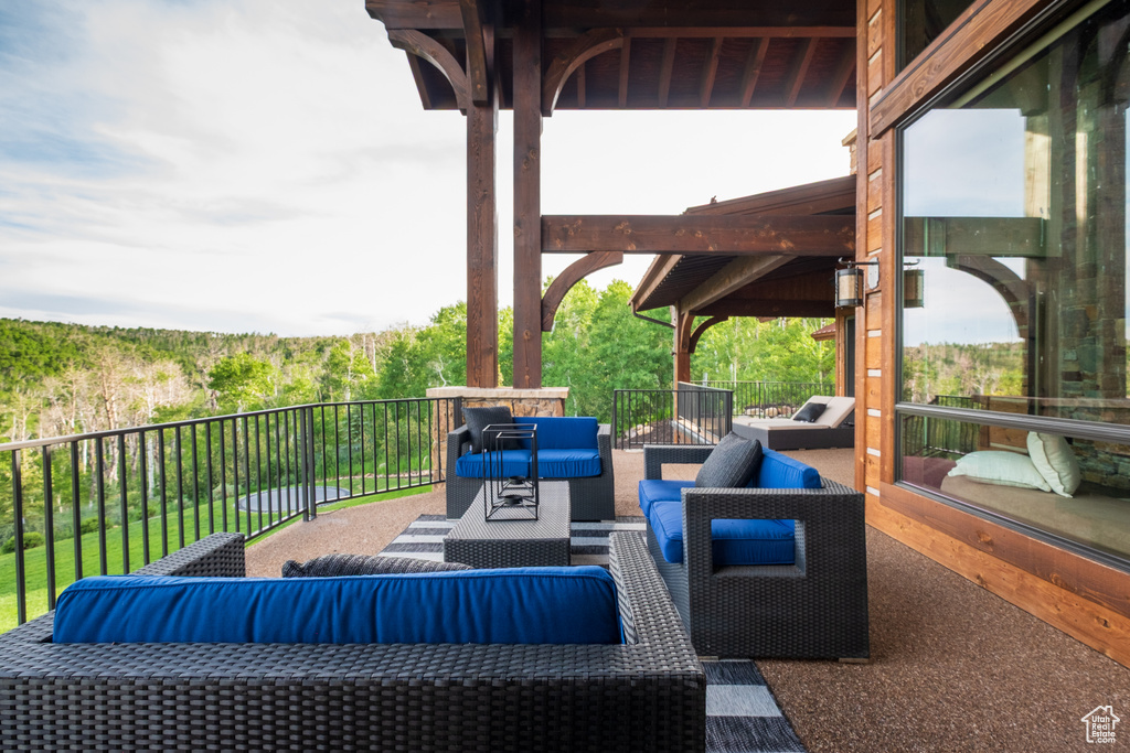 View of patio with an outdoor hangout area