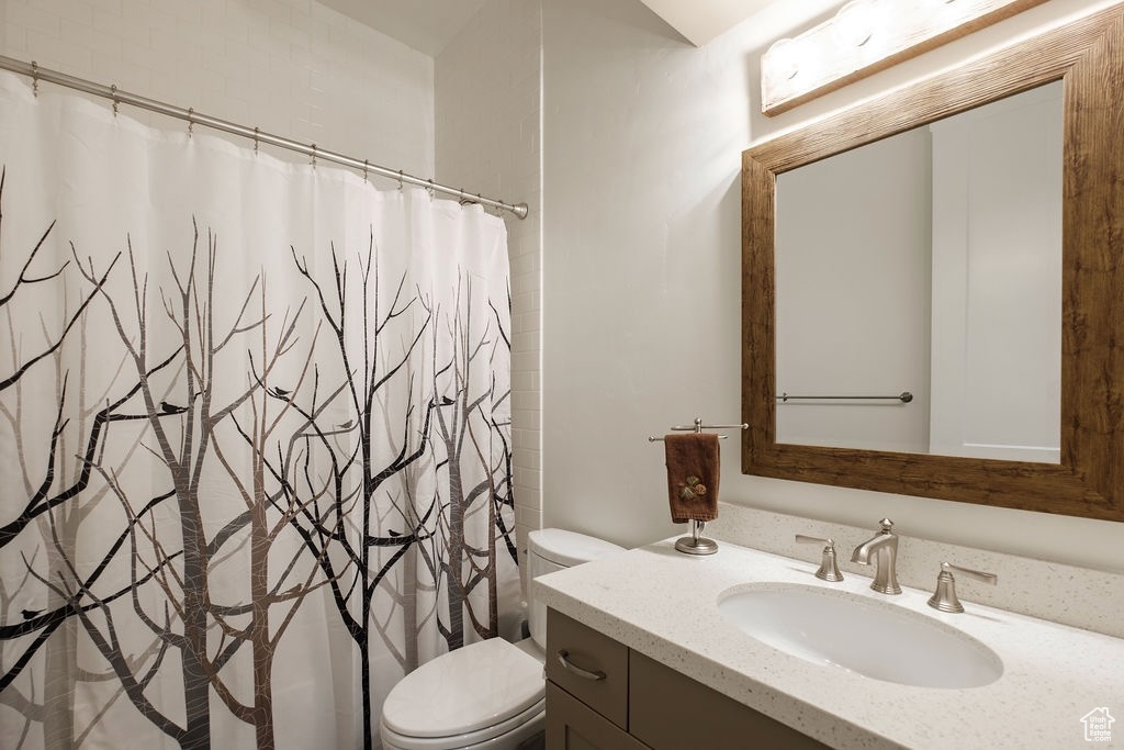 Bathroom with toilet and vanity