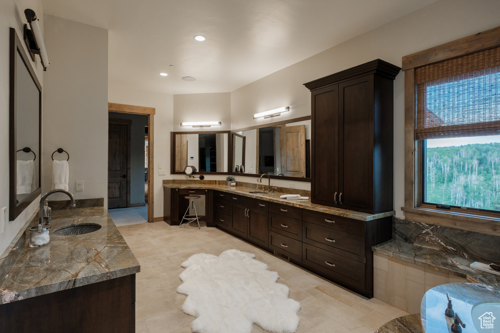 Bathroom featuring vanity and a bathtub