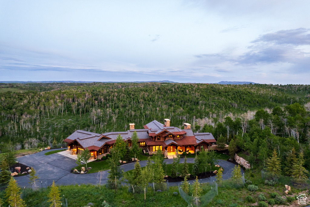 View of subject property featuring a forest